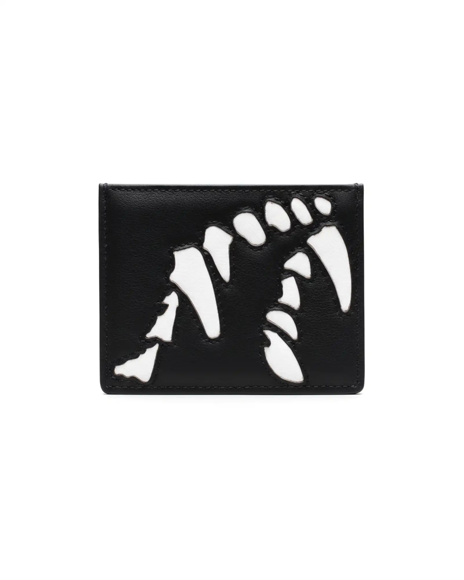 Black wallet with white fangs laser cut design on a white background